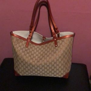 Gucci tote canvas bags with bronze leather straps.